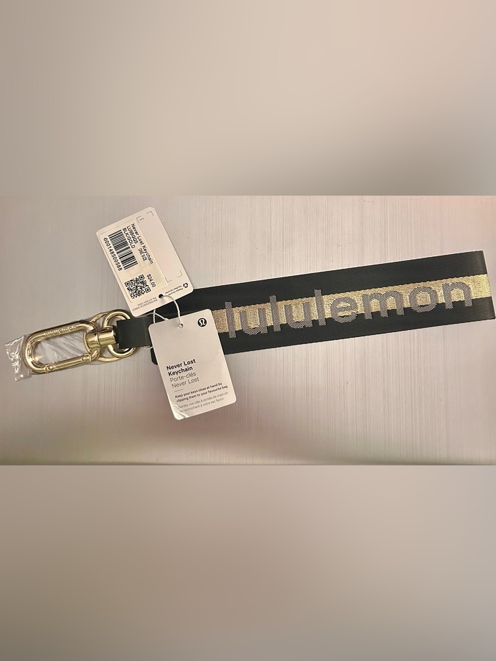 Lululemon Never Lost Keychain in Black and Gold